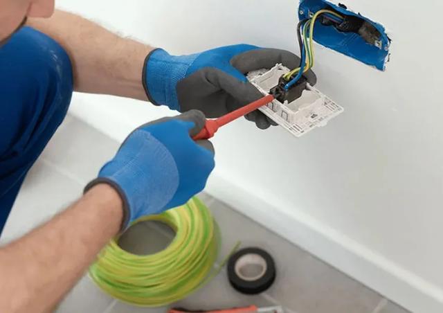 Electrician installing a power point